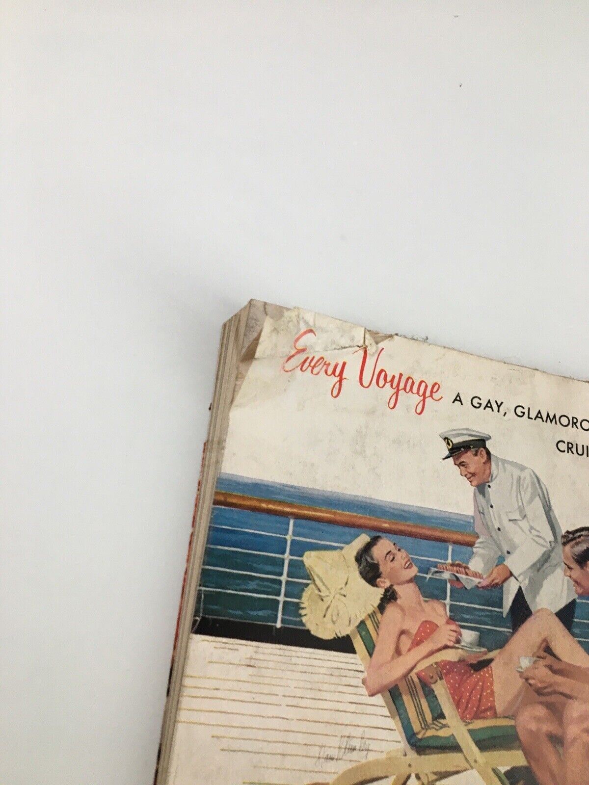 Harper's Bazaar Magazine February 1953 close-up of an advertisement for a glamorous cruise to South America, featuring stylish people enjoying leisure activities on a ship.