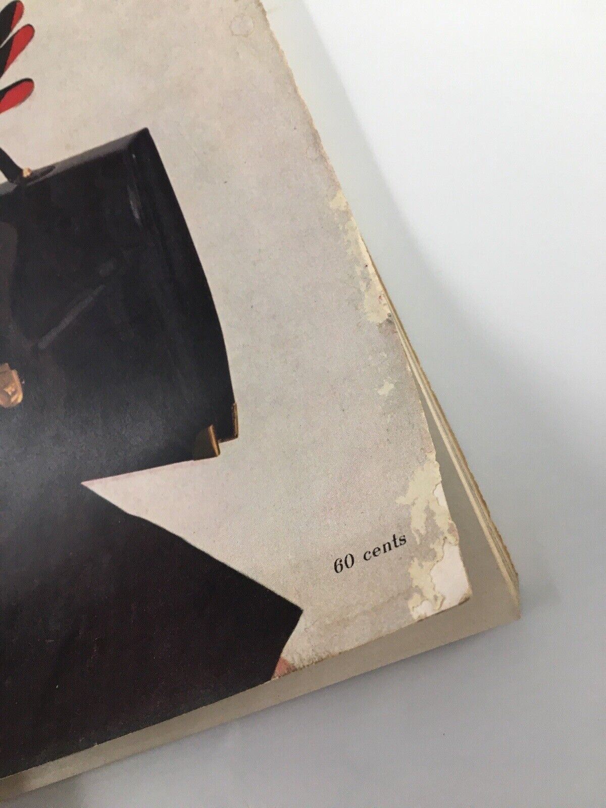 Close-up image of Harper's Bazaar Magazine February 1953 indicating the price of 60 cents, highlighting the vintage publication's historical value.