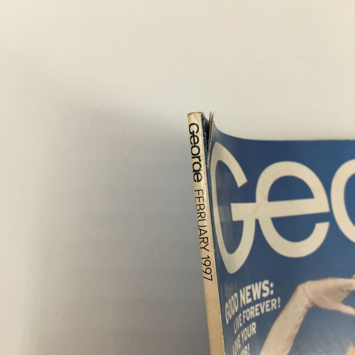 Detail view of the spine of George Magazine February 1997 featuring the title and issue date alongside a glimpse of the distinctive cover design.