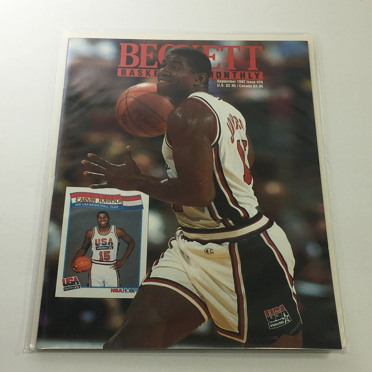 Cover of Beckett Basketball Monthly September 1992 Issue #26 featuring Earvin Johnson, showcasing a basketball player in action with USA Basketball memorabilia.