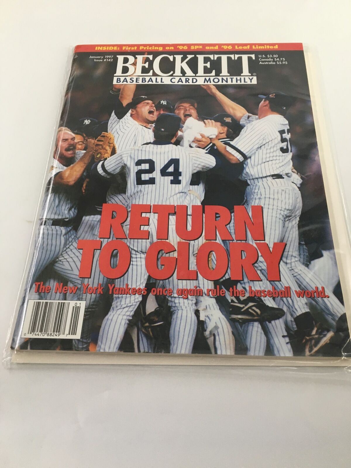 Beckett Baseball Card Monthly January 1997 #142 Return to Glory No Label VG - Cover of the magazine featuring baseball players celebrating with the headline 'RETURN TO GLORY'.