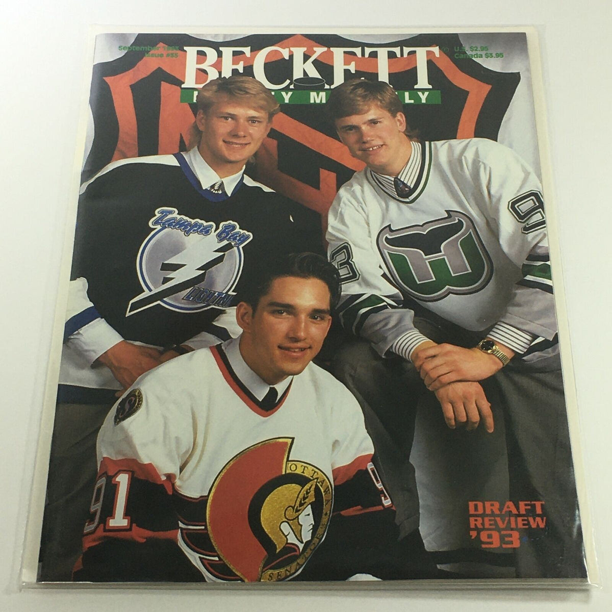 Cover of Beckett Hockey Monthly: September 1993 Issue #35 featuring three players in hockey jerseys from different teams, labeled 'Draft Review 1993'.