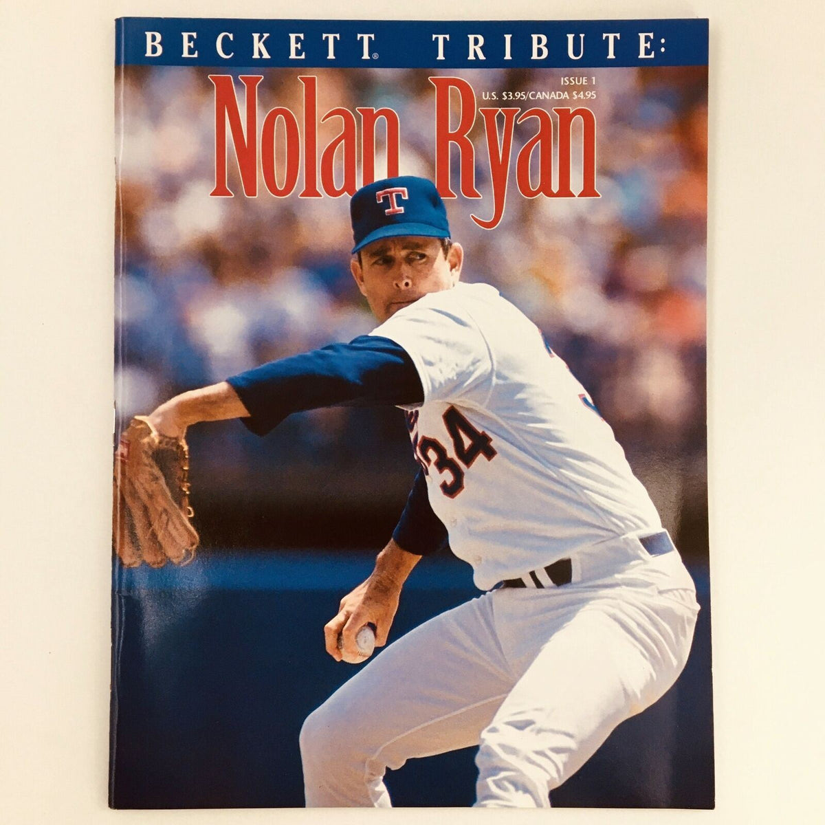 Beckett Tribute Magazine 1993 Issue 1 featuring Texas Ranger Nolan Ryan on the cover. The magazine showcases a high-quality image of Nolan Ryan in action, wearing a Texas Rangers jersey, with vibrant colors and bold text highlighting his name. Ideal for collectors and fans of baseball memorabilia.