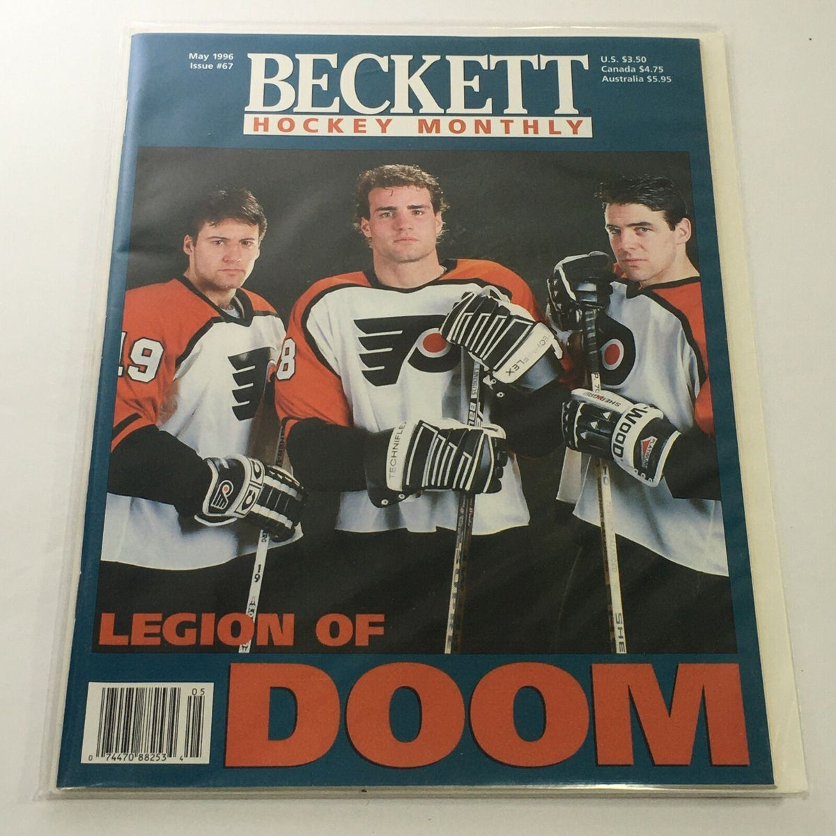 Beckett Hockey Monthly: May 1996 Issue #67 - Legion Of Doom cover featuring three hockey players in Philadelphia Flyers jerseys, showcasing a key moment in hockey history.