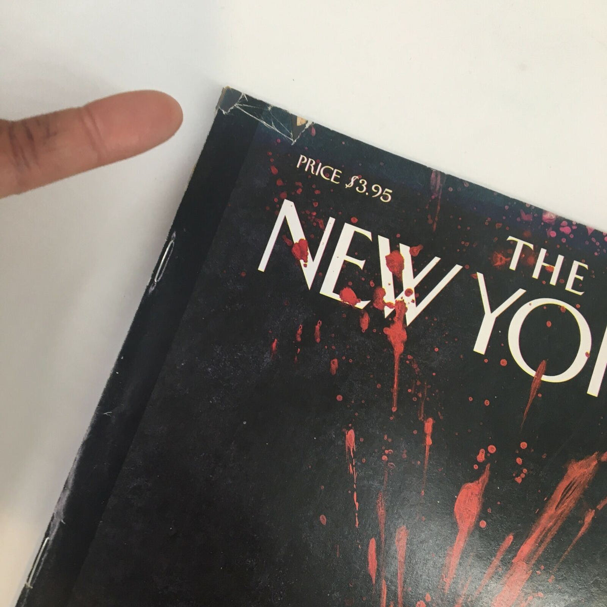Close-up view of the top corner of The New Yorker magazine from May 10, 2004, featuring the title 'New Yorker' and price of $3.95, illustrated with the cover art 'Open Wound' by Ana Juan.