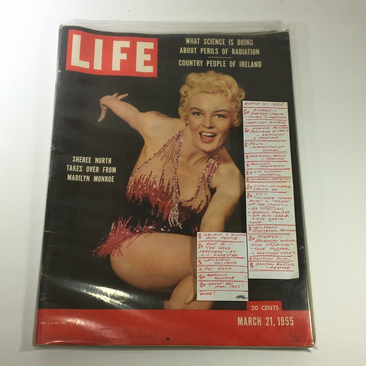 Life Magazine from March 21, 1955, encapsulating actress Sheree North on the cover, protected in a plastic sleeve, emphasizing its collectible nature.