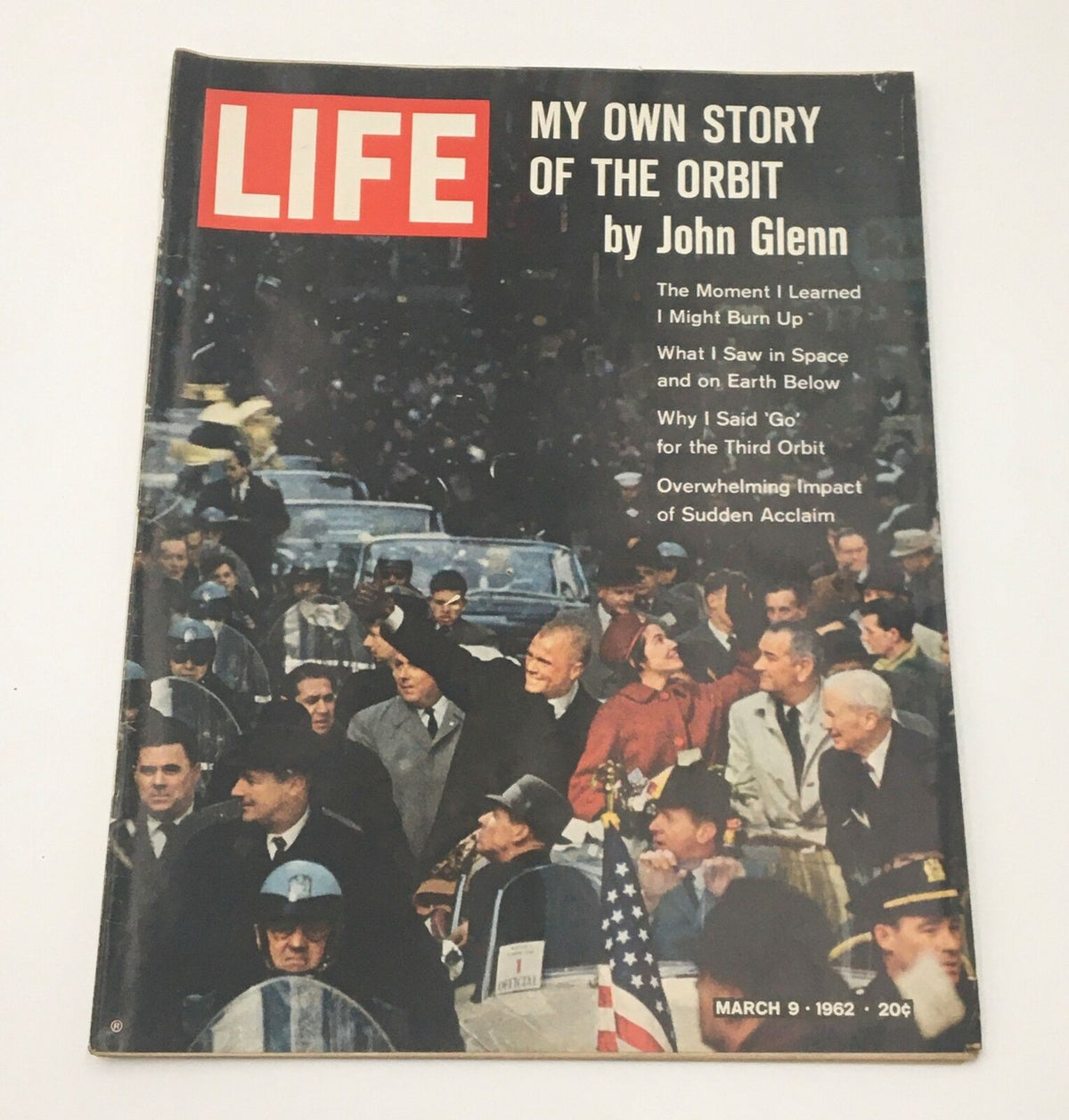 VTG Life Magazine March 9 1962 featuring the John Glenn story on the cover. The magazine showcases vibrant imagery and titles related to his orbit experience, capturing a historical moment in American space exploration.