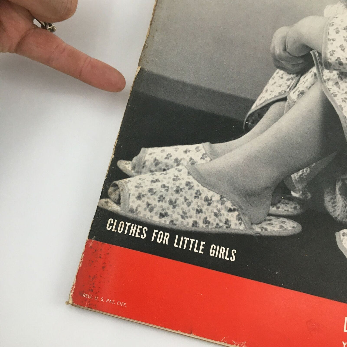 Detail of the bottom section of the VTG Life Magazine December 19, 1949 showing the text 'Clothes for Little Girls' along with a view of a girl's feet in floral slippers.
