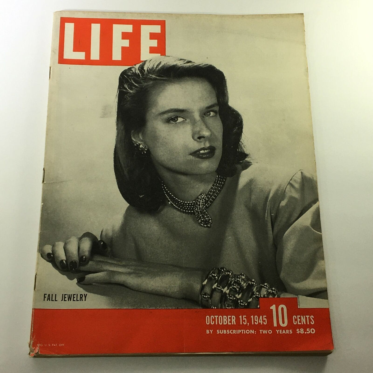 Cover of VTG Life Magazine October 15 1945 featuring a model showcasing fall jewelry, highlighting post-war fashion and aesthetics.