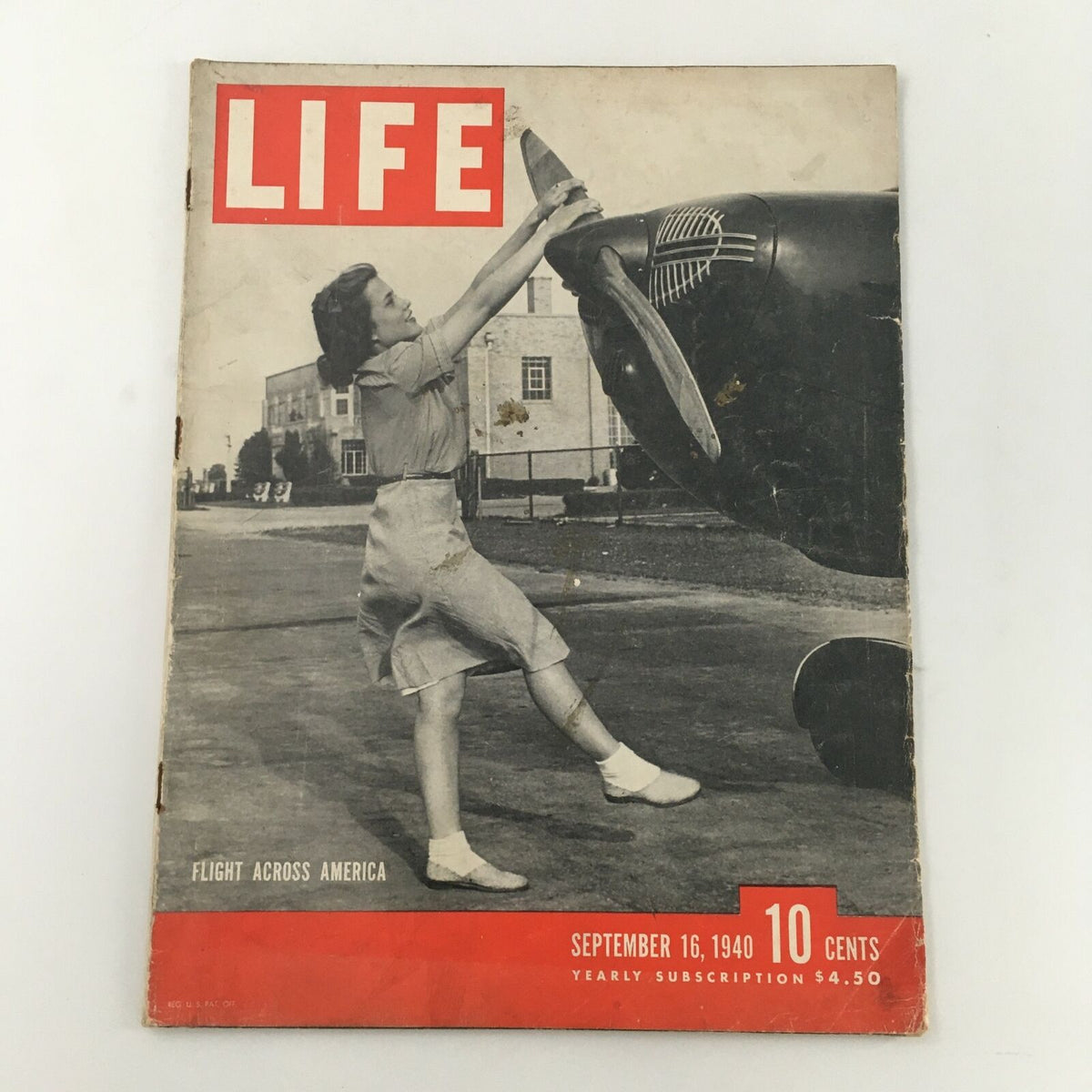 VTG Life Magazine September 16 1940 featuring a woman interacting with an airplane propeller, showcasing the excitement of aviation and travel in the early 20th century. This vintage cover highlights the 'Flight Across America' feature.