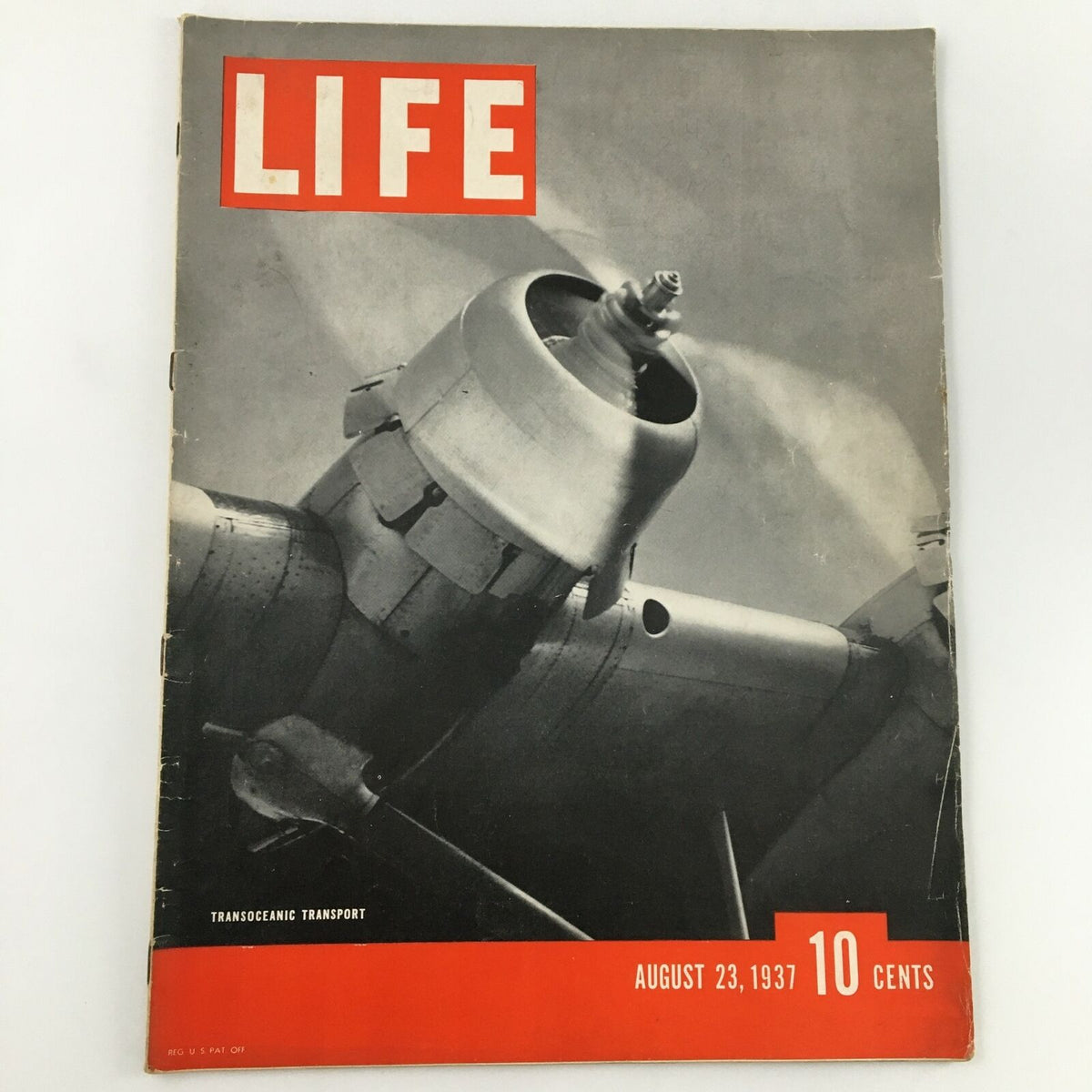VTG Life Magazine dated August 23, 1937 featuring transoceanic transport on the cover with a vintage aircraft engine image and bold title 'LIFE'.