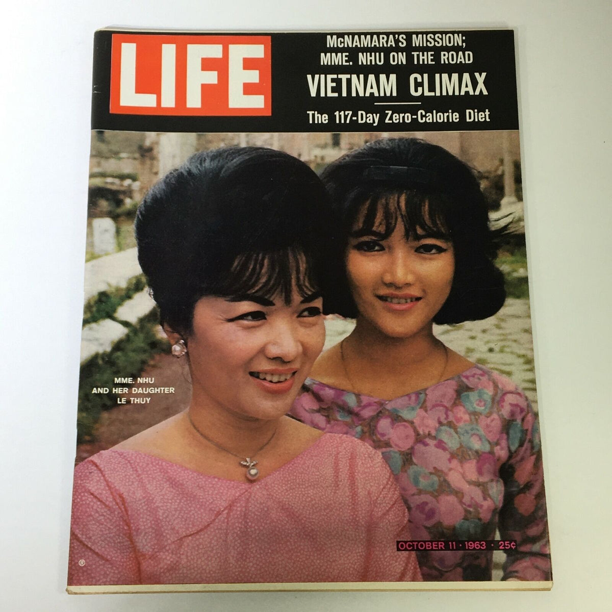 Cover of VTG Life Magazine October 11, 1963 featuring Madame Nhu and her daughter Le Thuy, showcasing a moment in history with a vibrant color image and prominent title.