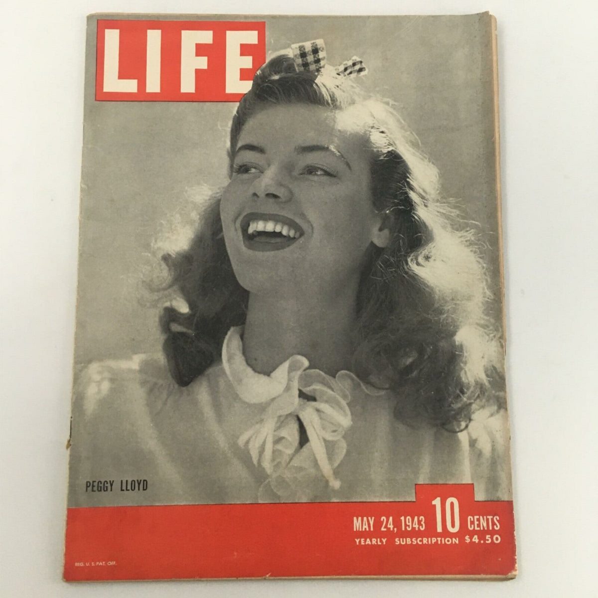 Cover of VTG Life Magazine dated May 24, 1943 featuring Peggy Lloyd, showcasing a smiling woman with classic 1940s style.