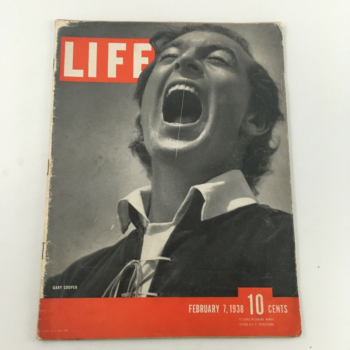 Cover of the VTG Life Magazine from February 7, 1938, featuring actor Gary Cooper with a dramatic expression, capturing the essence of 1930s Hollywood. This vintage magazine showcases a piece of cinematic history and is perfect for collectors and enthusiasts.