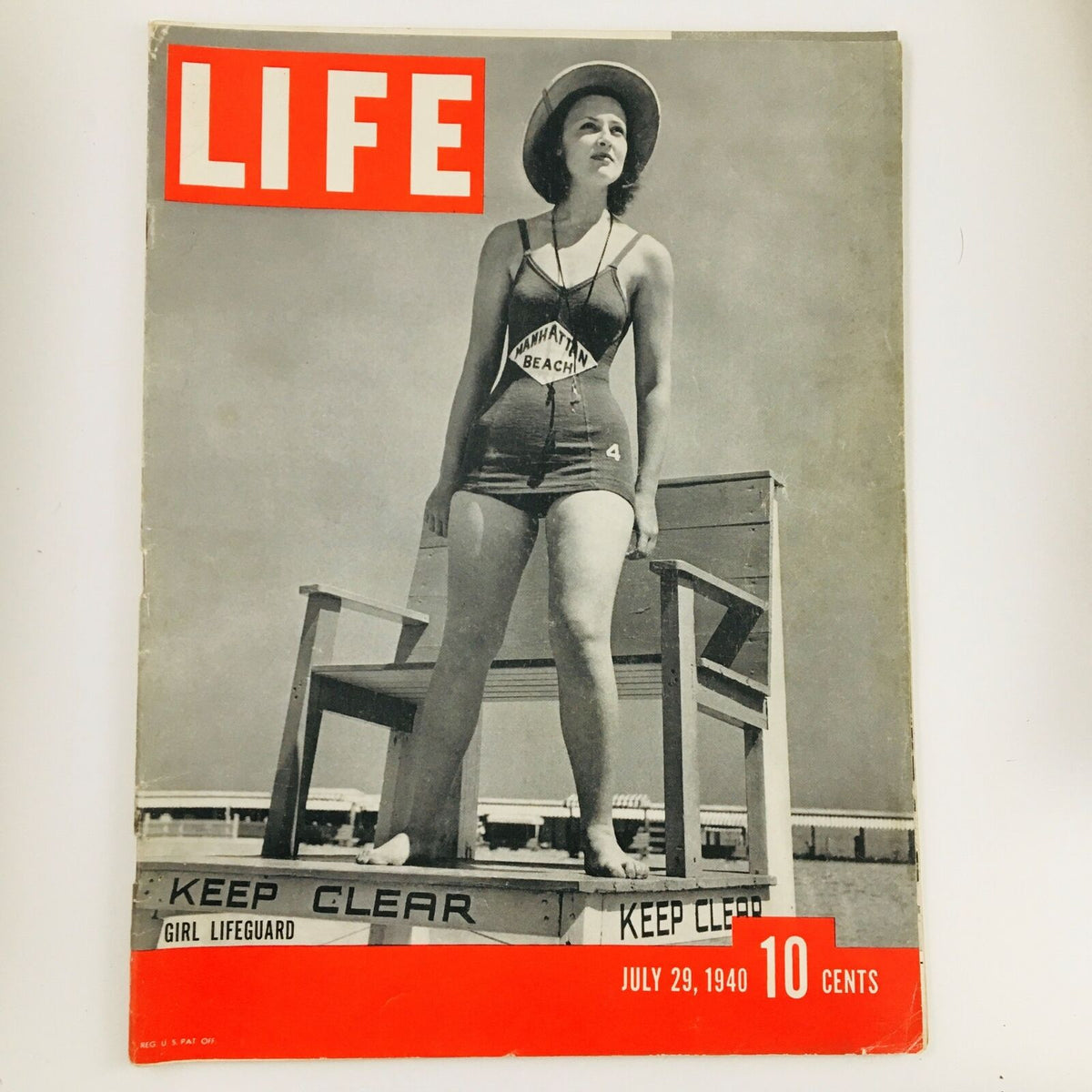 VTG Life Magazine July 29 1940 Photograph of a Girl Lifeguard, featuring a vintage image of a girl standing confidently in a lifeguard outfit on a beach, with the magazine's title and date prominently displayed.