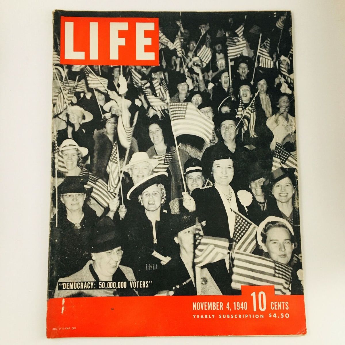 Cover of VTG Life Magazine from November 4, 1940, featuring the title 'The Democracy of 50,000 Voters'. The image shows a crowd of women holding American flags, emphasizing the theme of civic participation.