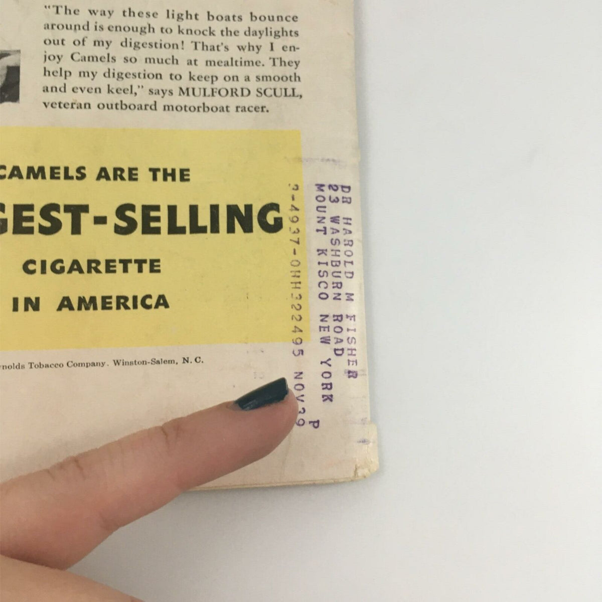Close-up of the back cover of VTG Life Magazine January 31, 1938, highlighting the text 'Camels are the largest-selling cigarette in America' and an address label.
