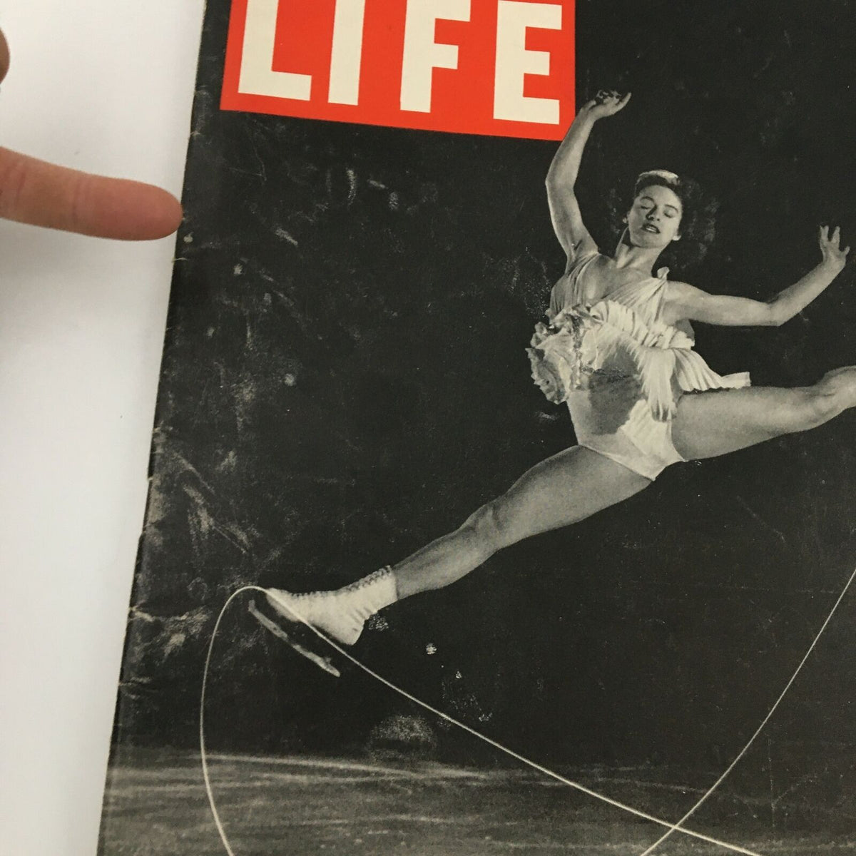 Close-up of the cover of Vintage Life Magazine March 26 1945, displaying Carol Lynne by Mili, with a focus on the skater's dynamic pose and details of the magazine's condition.