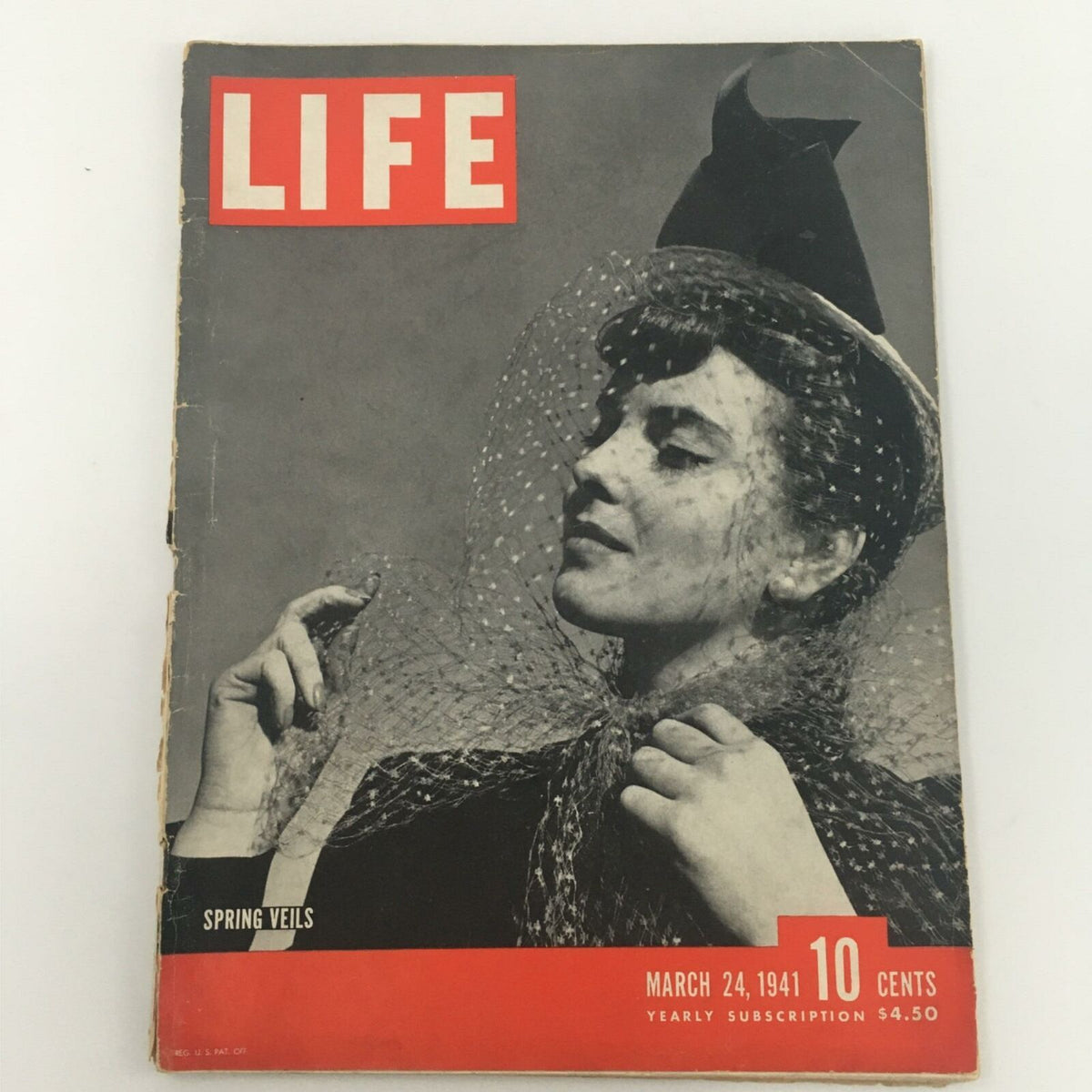 Cover of VTG Life Magazine from March 24, 1941, featuring Spring Veils and model with a black hat and netting, showcasing vintage fashion and historical design.