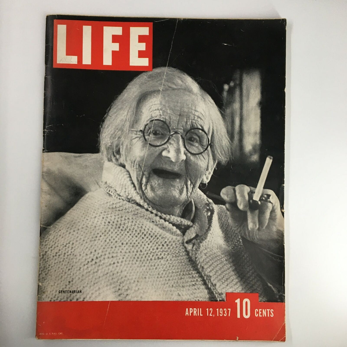 Cover of VTG Life Magazine April 12 1937 featuring a centenarian woman smiling, showcasing the magazine's vintage design and historical significance.