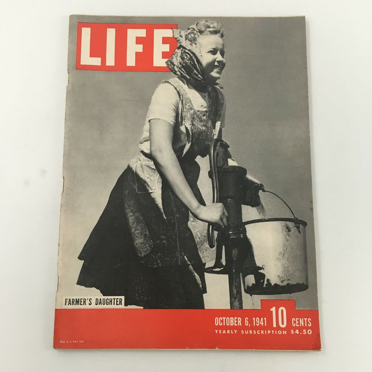 Vintage Life Magazine cover from October 6, 1941, featuring the theme 'Farmer's Daughter' with a smiling woman in traditional dress, highlighting rural American culture.