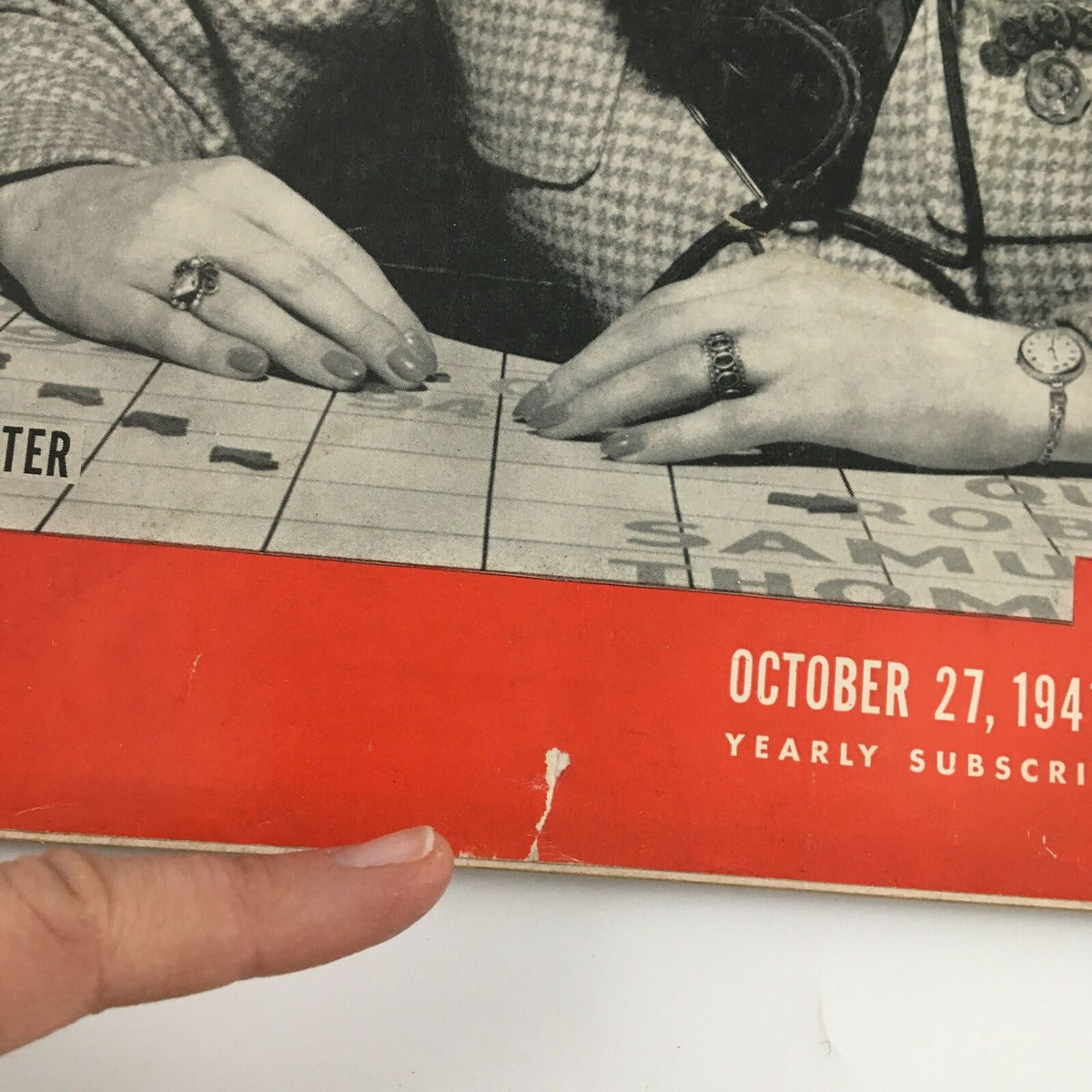 Close-up view of the Vintage Life Magazine from October 27, 1941 showcasing minor wear, including a small rip, emphasizing condition details for collectors.