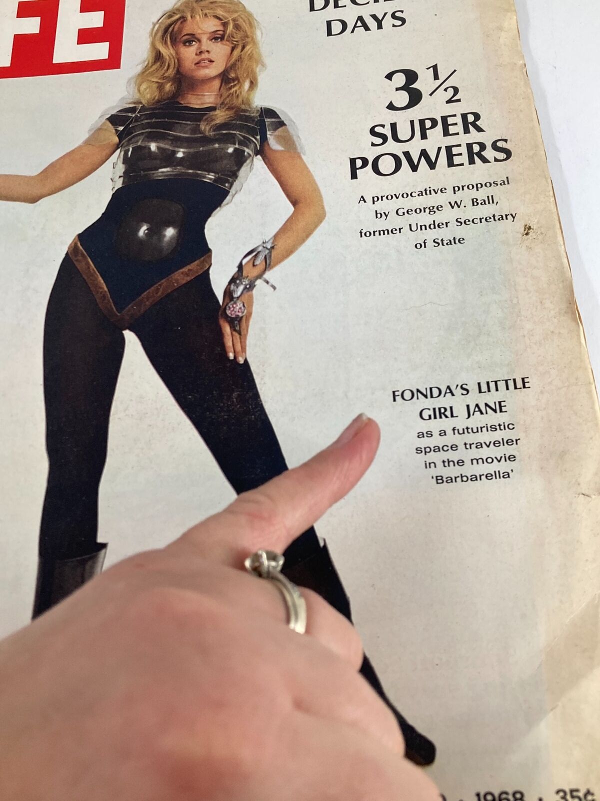 Close-up of the Vintage Life Magazine cover from March 29, 1968 highlighting Jane Fonda as 'Barbarella' with the caption 'Fonda's Little Girl Jane' and a hand pointing at the title.
