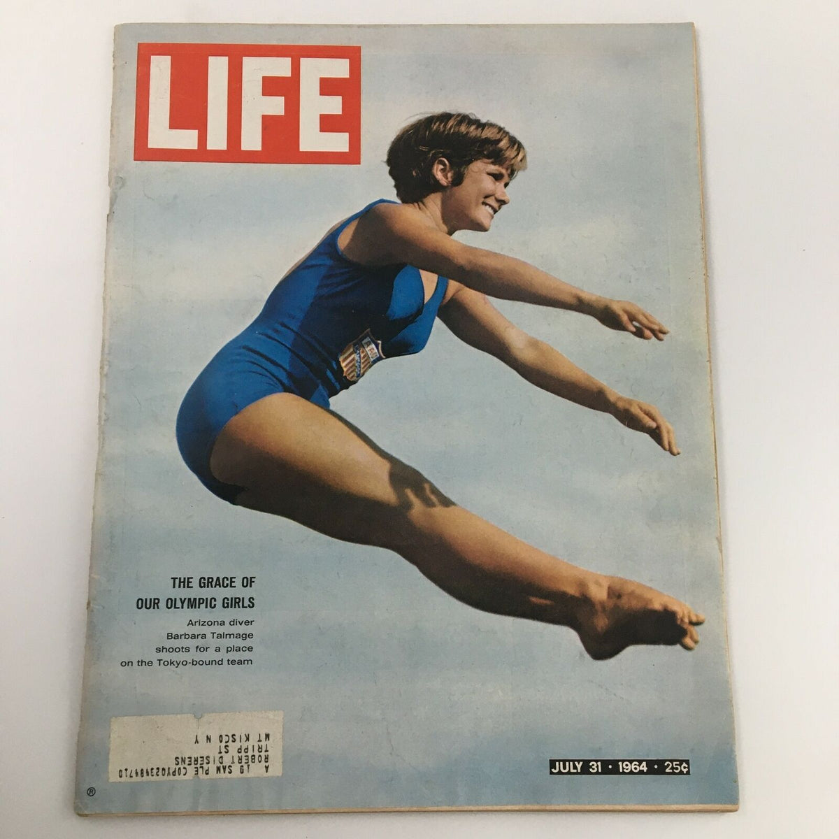 Cover photo of VTG Life Magazine dated July 31, 1964, featuring Arizona diver Barbara Talmage in a blue swimsuit, showcasing her athletic leap, representing the diving culture of the 1960s.