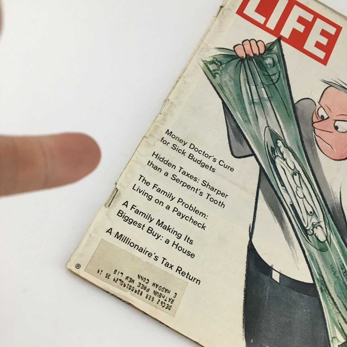 Close-up of the cover of VTG Life Magazine April 6 1962, highlighting articles on money management, including 'The Family Problem: Living on a Paycheck'.