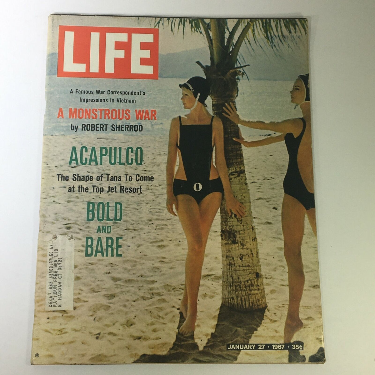 Cover of VTG Life Magazine from January 27, 1967 featuring the title 'A Monstrous War' by Robert Sherrod. The cover displays two women in vintage swimsuits standing beside a palm tree at a beach, highlighting the magazine's vintage aesthetic and cultural context.