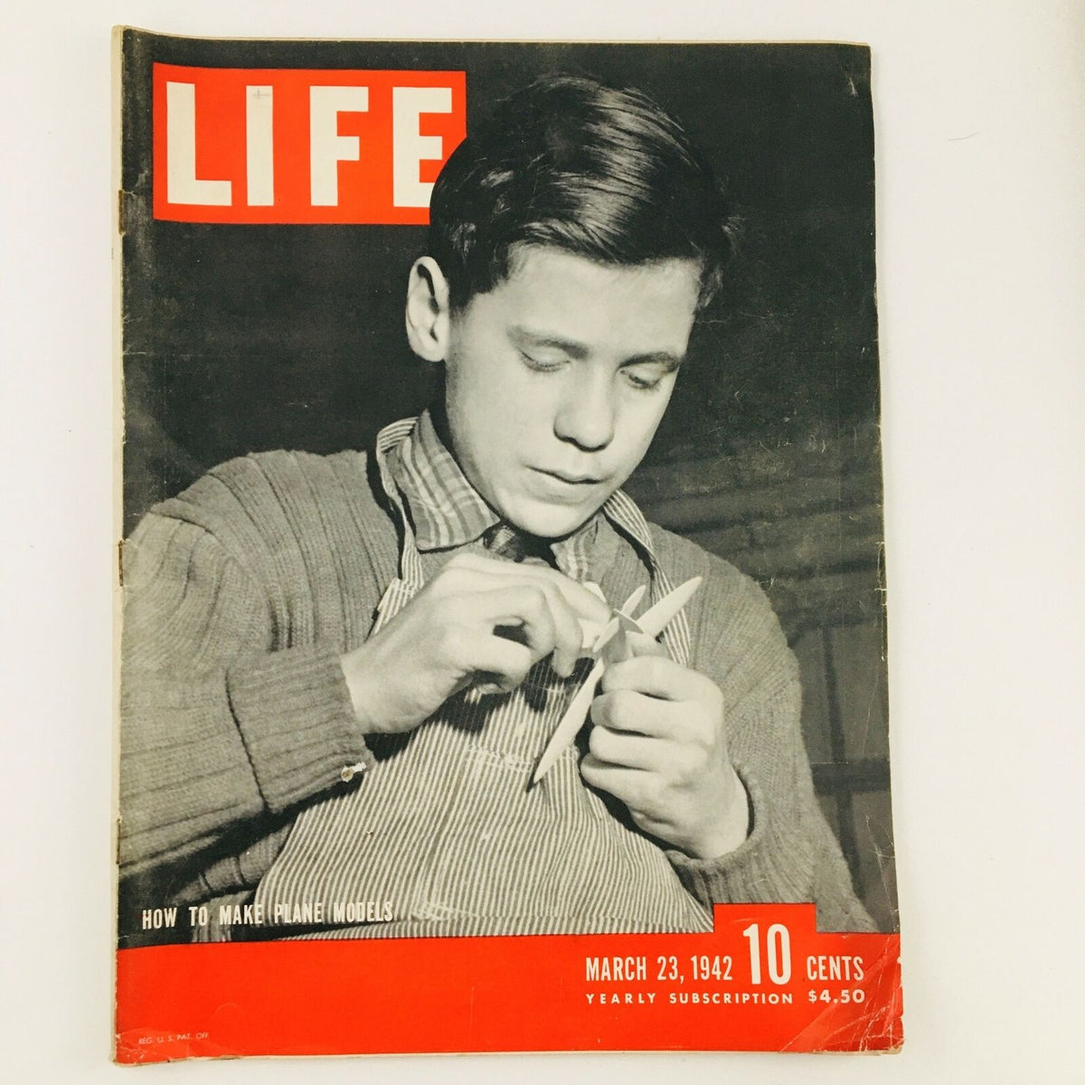 Cover of VTG Life Magazine March 23, 1942 showcasing an article on How To Make Plane Models, featuring a young boy engaged in crafting a model.