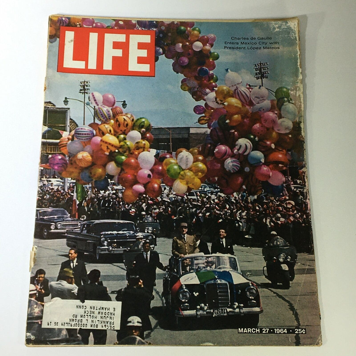 Vintage Life Magazine cover from March 27, 1964 featuring Charles de Gaulle during his visit to Mexico City, adorned with colorful balloons.