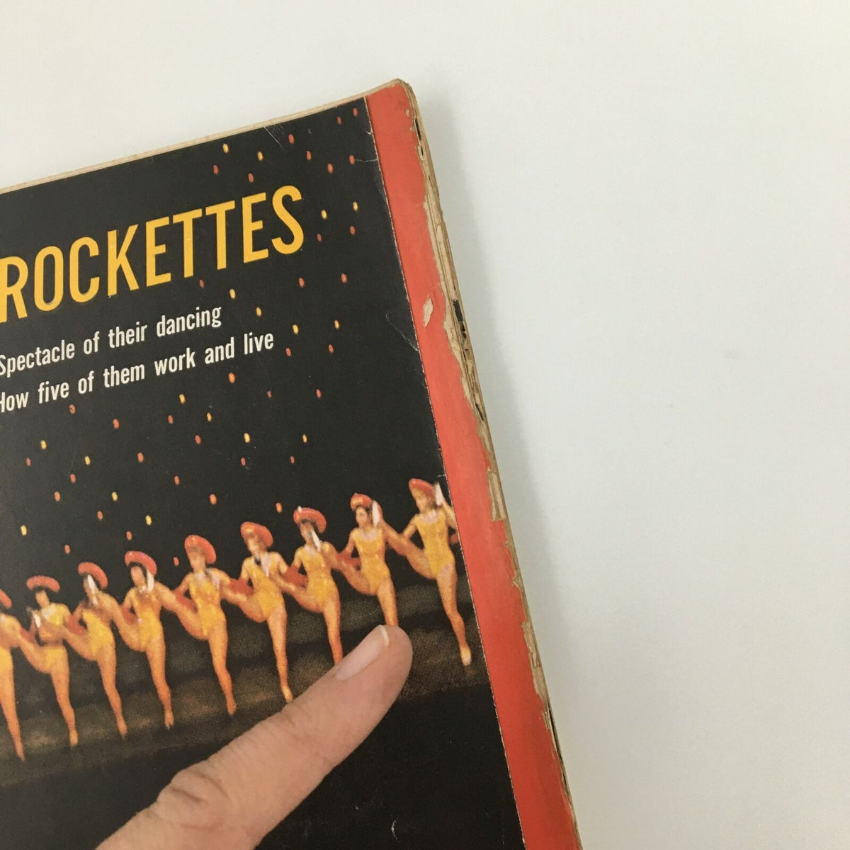 Close-up of the cover of VTG Life Magazine December 11, 1964, featuring The Rockettes, with focus on the title and a dancer's pose, emphasizing the magazine's vintage appeal and connection to classic performance art.