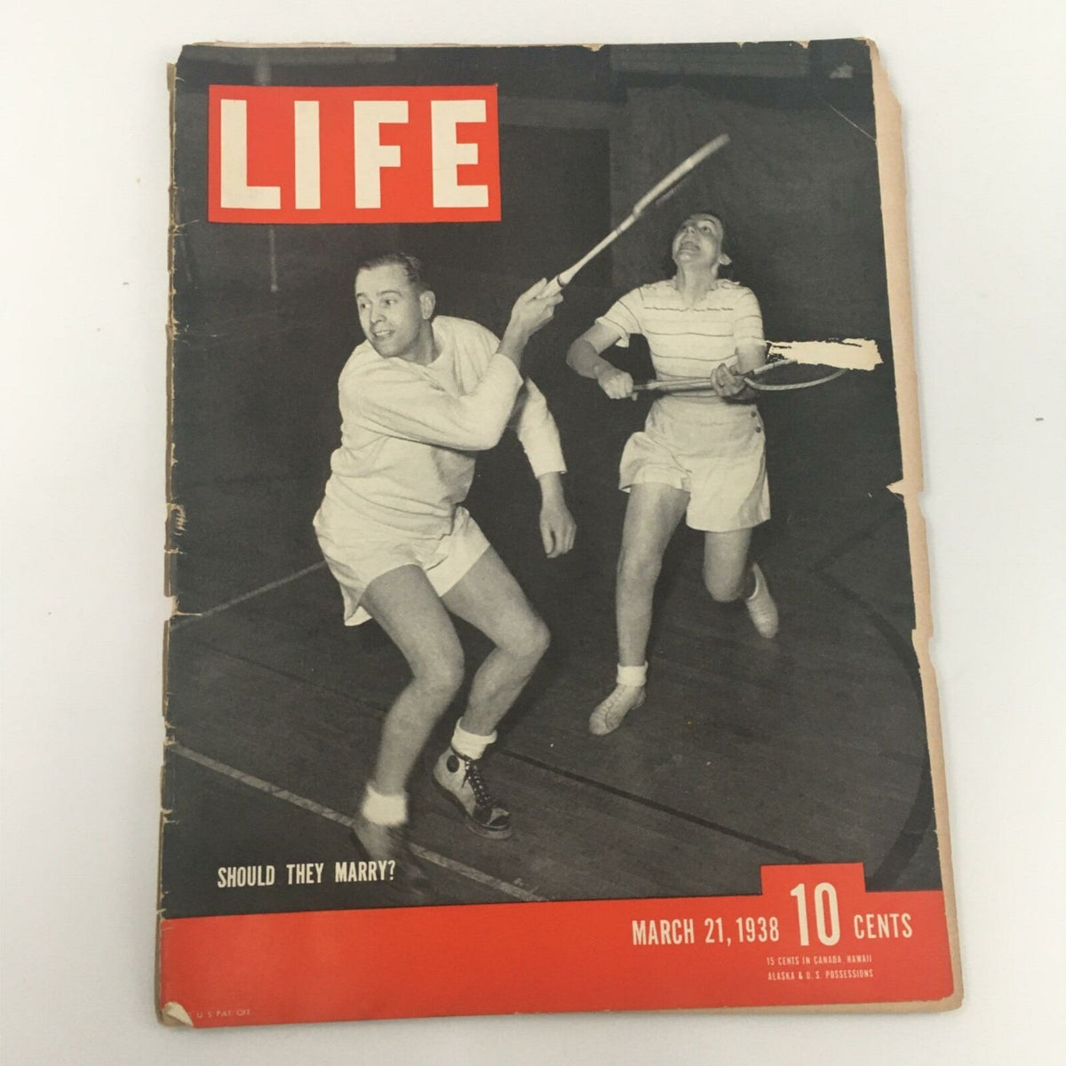Cover of VTG Life Magazine March 21, 1938, featuring a lively scene with two players engaged in a badminton game, showcasing the article title "Should They Marry?"