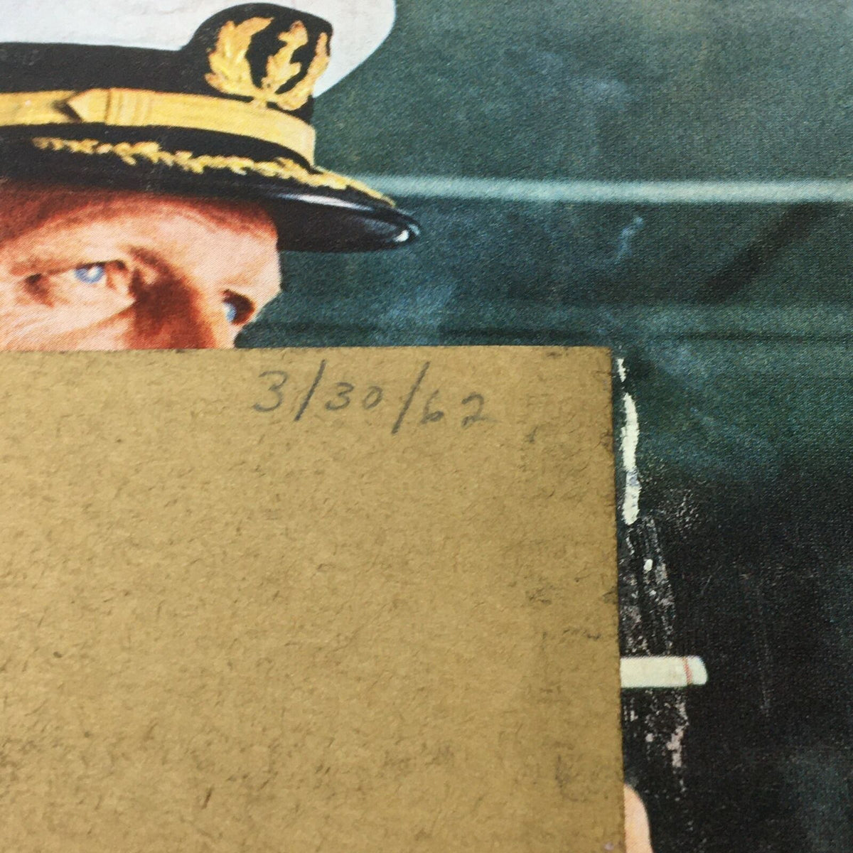 Close-up detail of the cover of VTG Life Magazine March 30 1962 showcasing a handwritten date, emphasizing its vintage authenticity and connection to the past.