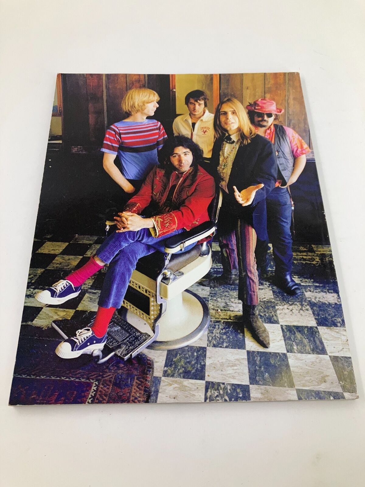 Image from 2015 Life Magazine titled 'The Grateful Dead 50 Years Along The Golden Road,' featuring the iconic band members in a colorful setting, showcasing their unique style and cultural influence.