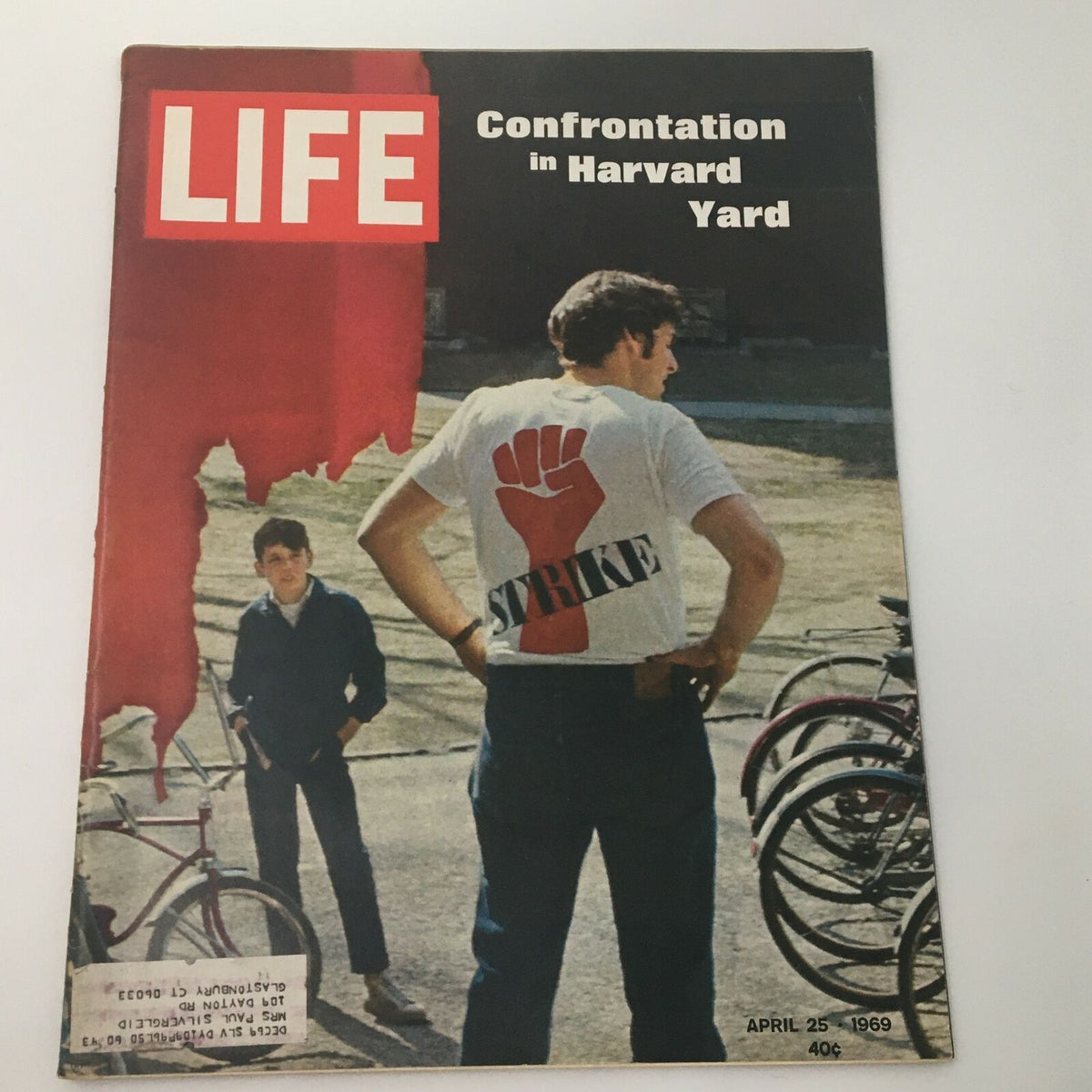VTG Life Magazine April 25 1969 featuring a cover story 'Confrontation in Harvard Yard' with imagery depicting student protests and social change, showcasing a person wearing a 'STRIKE' t-shirt and another figure in the background.
