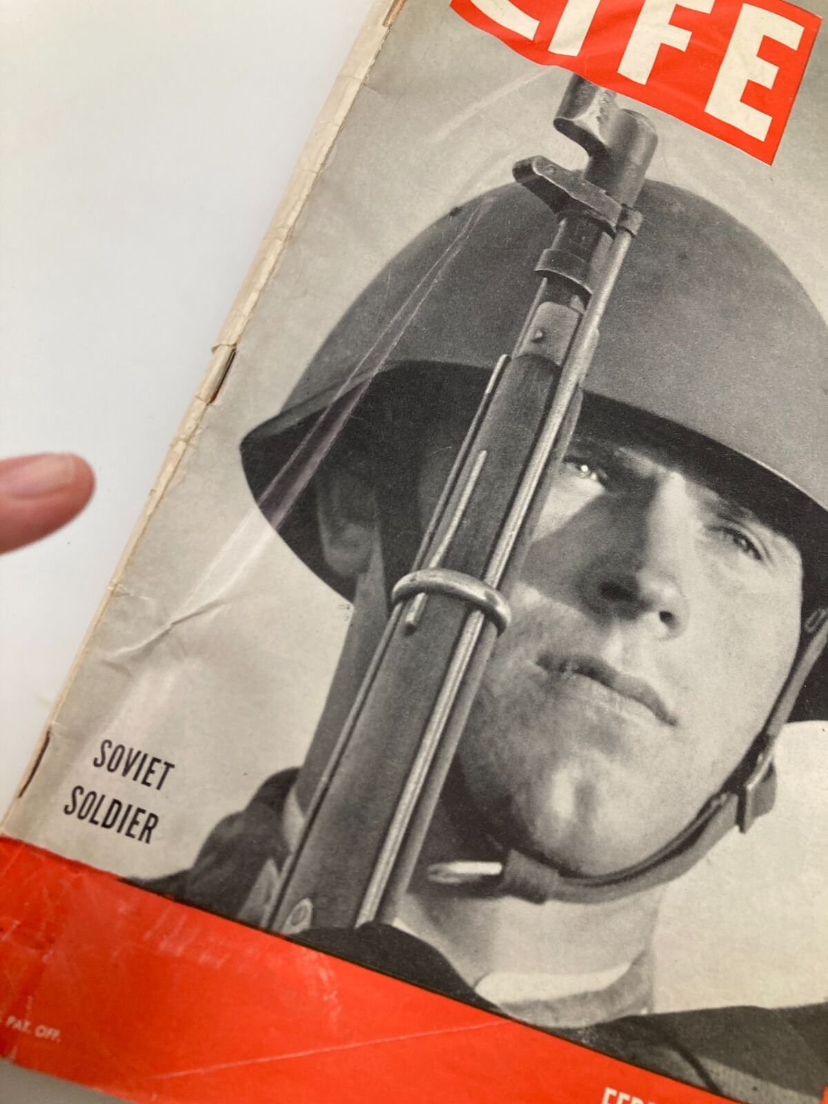 Close-up of the cover of VTG Life Magazine February 12, 1945, showcasing a Soviet soldier's portrait with details of the magazine's title and date.