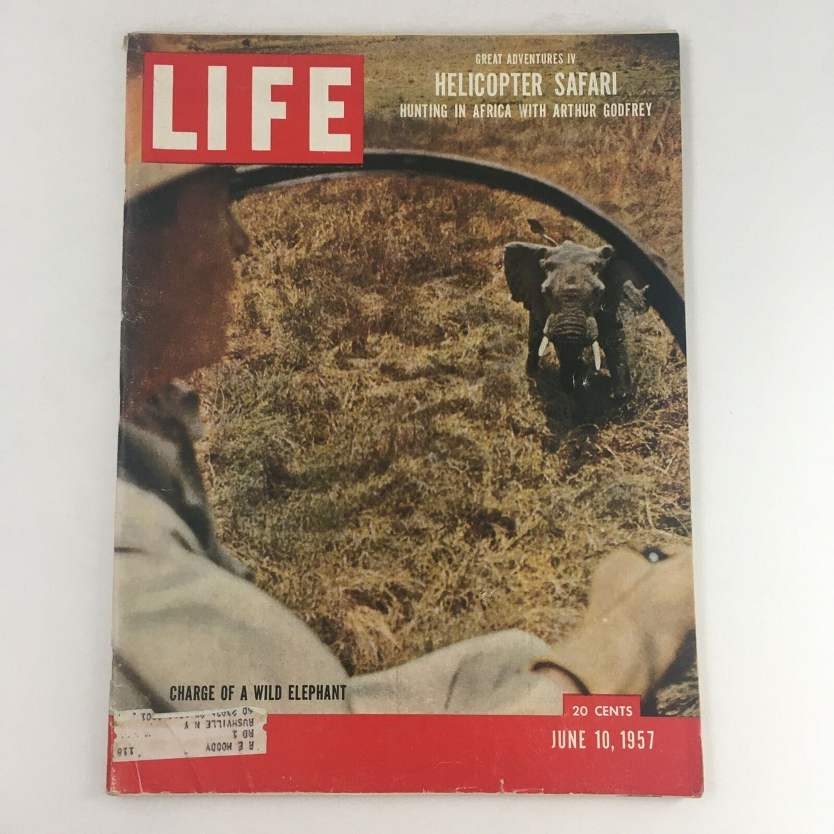 Cover of Life Magazine from June 10, 1957, featuring the article 'Charge Of A Wild Elephant' with a striking image of an elephant in the wild and a glimpse of the hunter in the foreground. Ideal for collectors and vintage magazine enthusiasts.