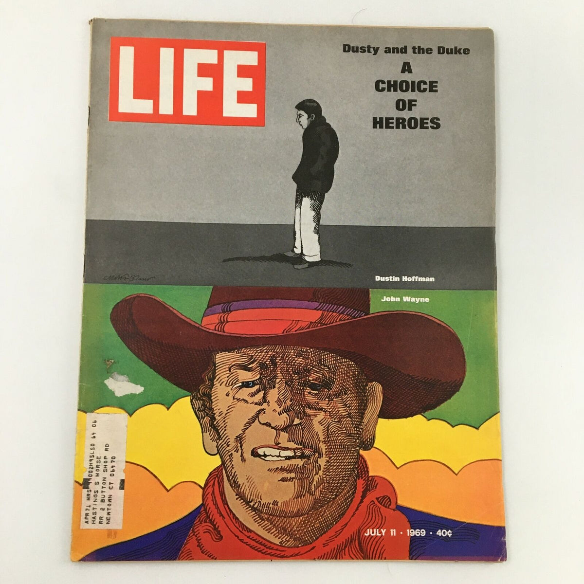 VTG Life Magazine July 11, 1969 cover featuring an illustration of Dustin Hoffman and John Wayne, titled 'Dusty and the Duke: A Choice of Heroes.' This vintage magazine captures a pivotal moment in Hollywood history.