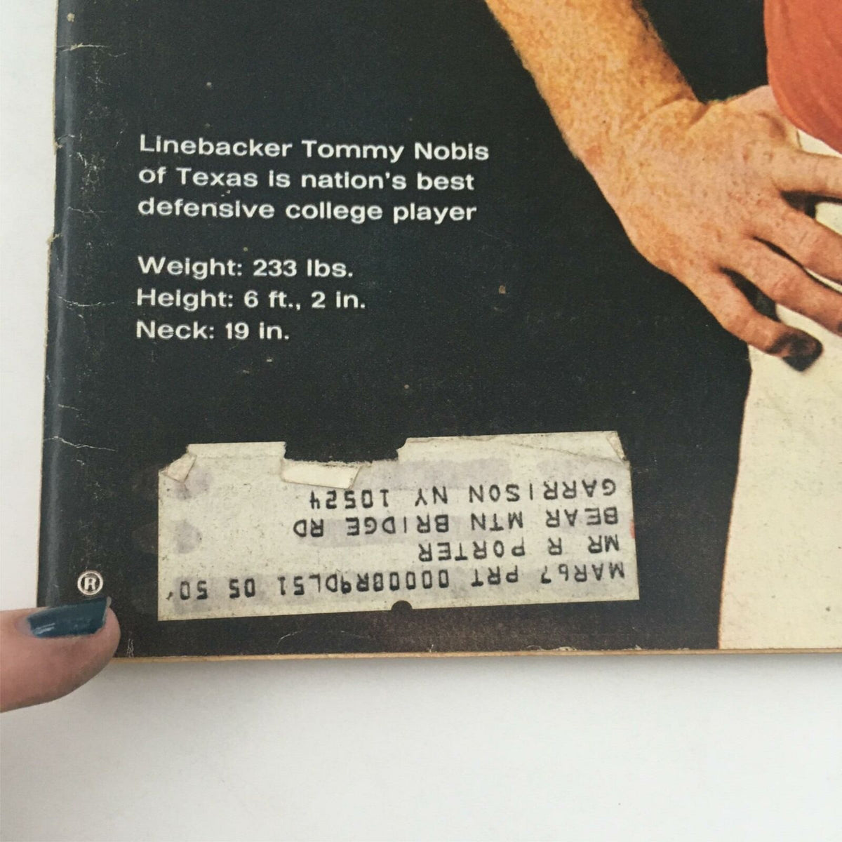 Close-up view of the back cover of Vintage Life Magazine December 10, 1965 highlighting linebacker Tommy Nobis's details including weight, height, and neck size.
