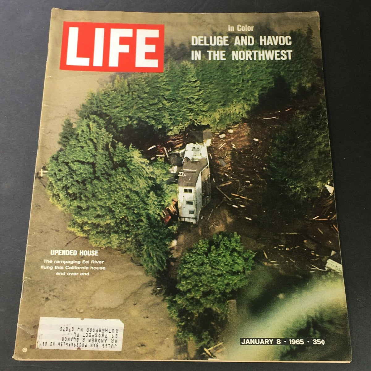 Cover of VTG Life Magazine from January 8, 1965, featuring the headline 'Deluge and Havoc In The Northwest' with an aerial view of a house impacted by environmental disasters in California.