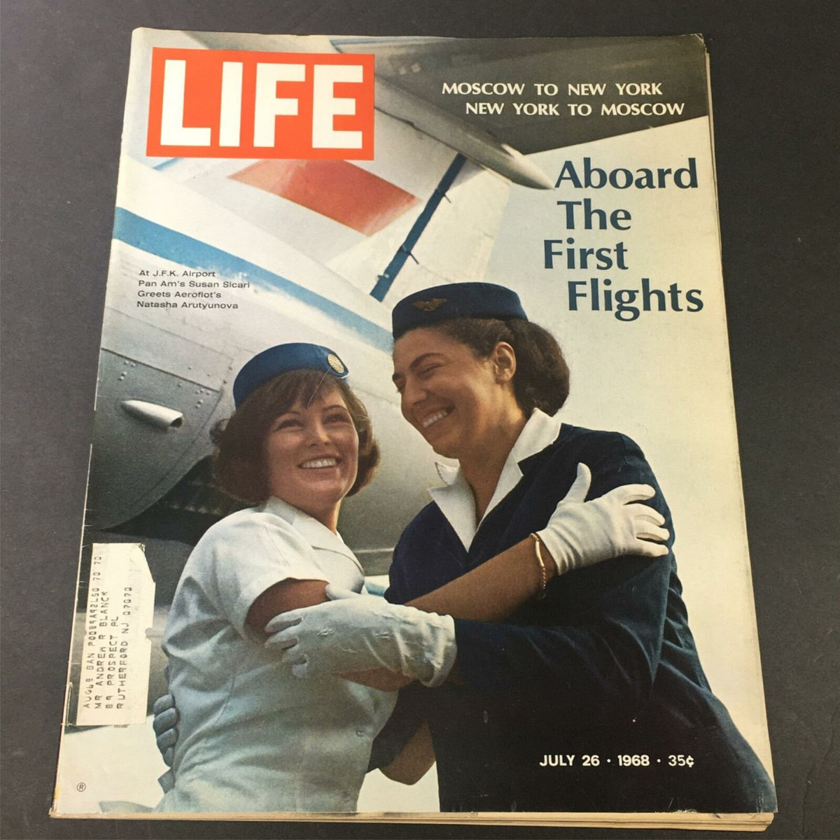 VTG Life Magazine cover from July 26, 1968, featuring Susan Sicari greeting Natasha Arutyunova at JFK Airport, highlighting vintage aviation history.