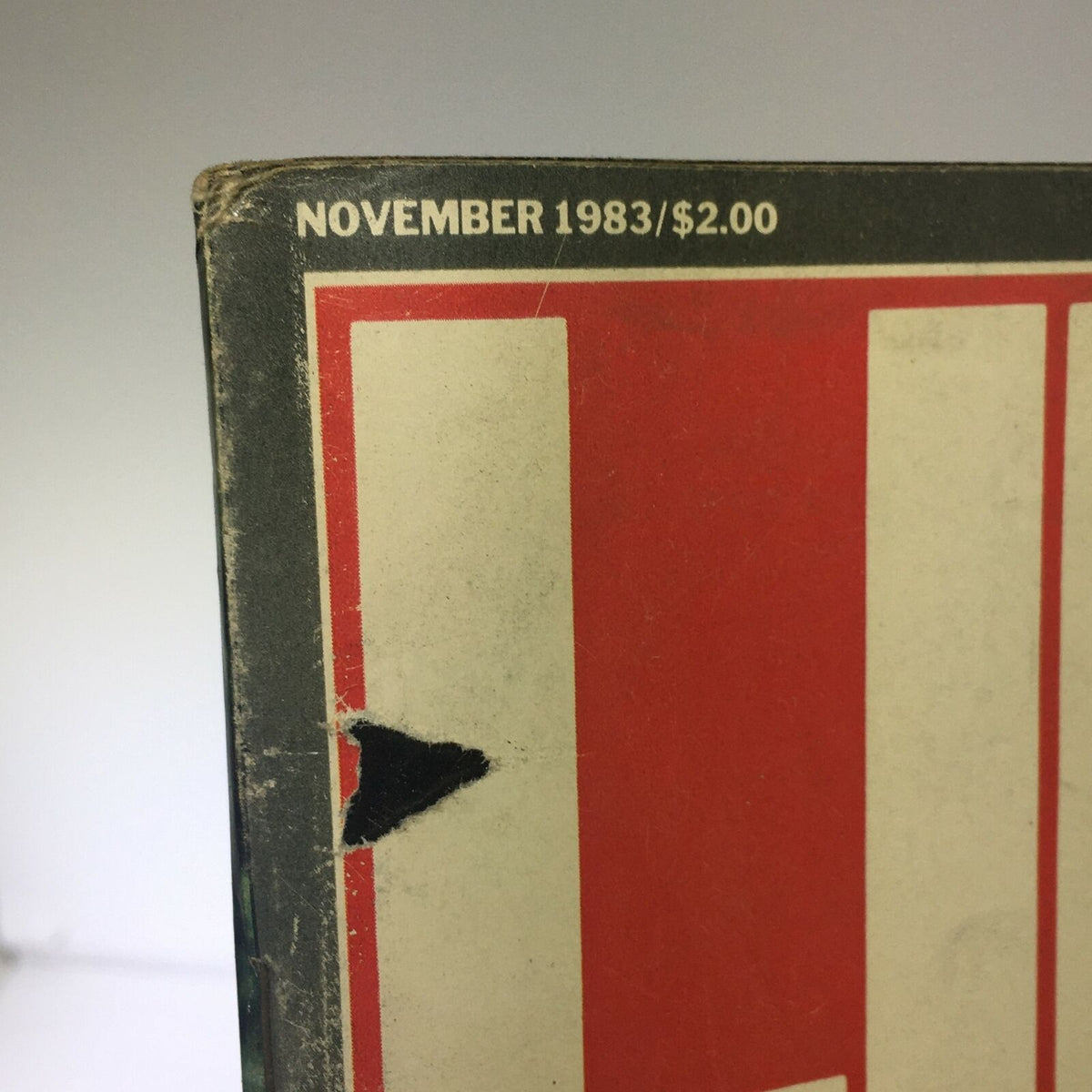 Close-up view of the spine of VTG Life Magazine November 1983, highlighting the publication date and price, showcasing its vintage condition and historical significance regarding the John F. Kennedy Assassination.