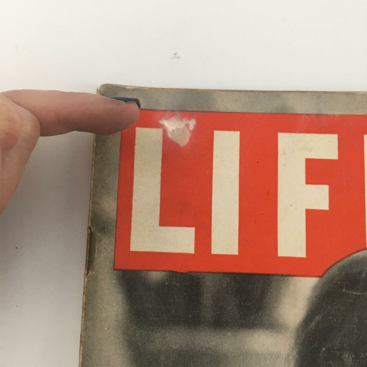 Detailed image of the top corner of VTG Life Magazine January 24, 1944, showing a small tear on the 'LIFE' title section.