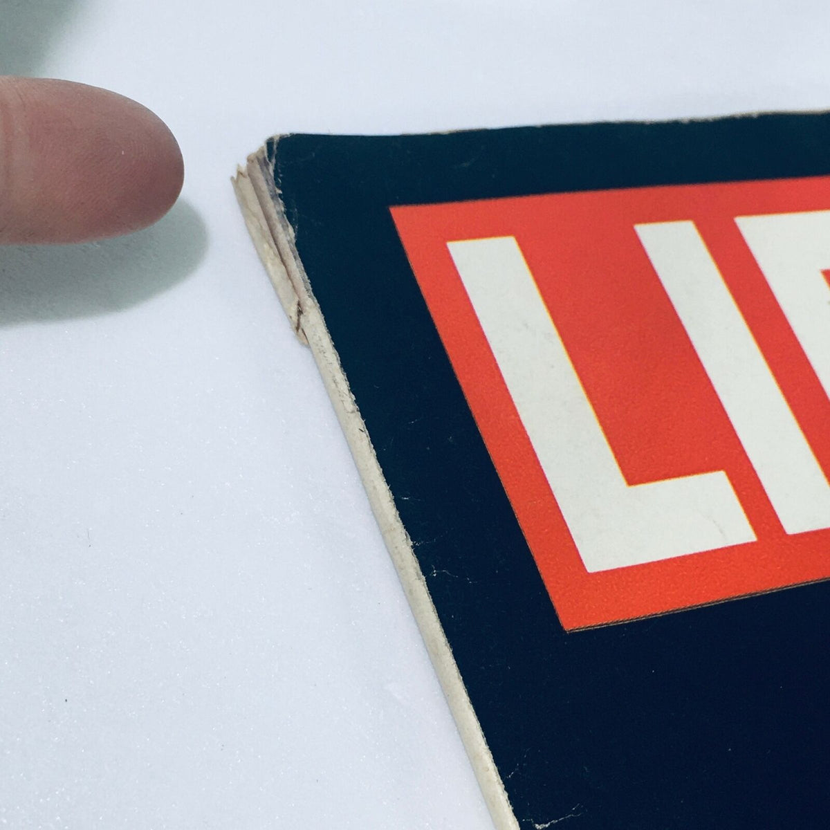 Close-up shot of the edge of the VTG Life Magazine from October 10, 1969, displaying the title 'LIFE' and a visible address label, highlighting its vintage condition and authenticity.