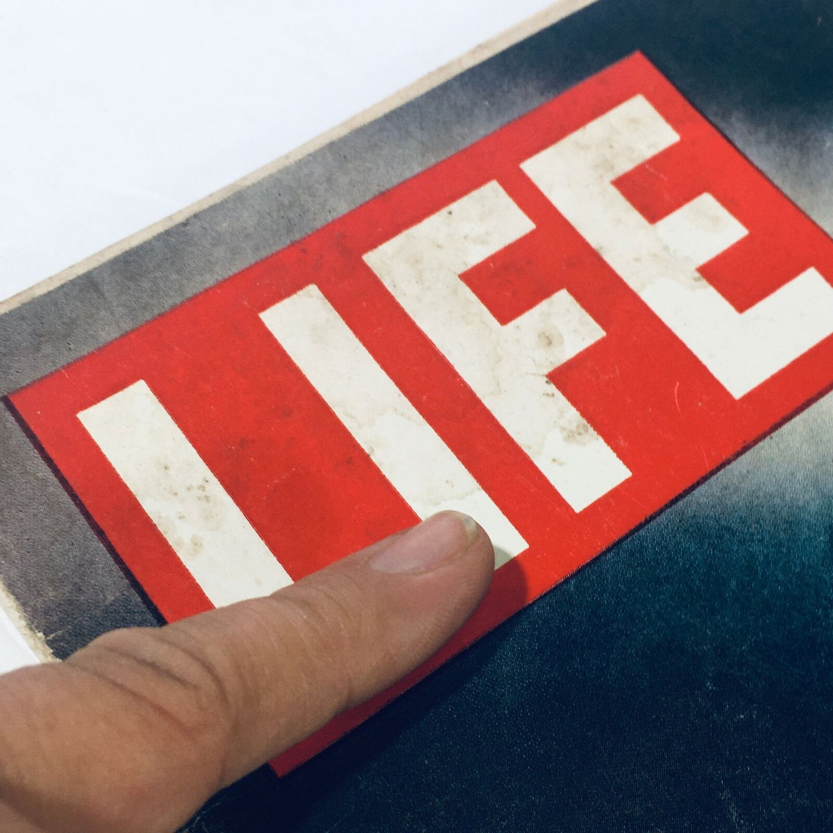 Close-up view of the 'LIFE' logo on the cover of the VTG Life Magazine January 4 1963, showcasing its vintage appearance.