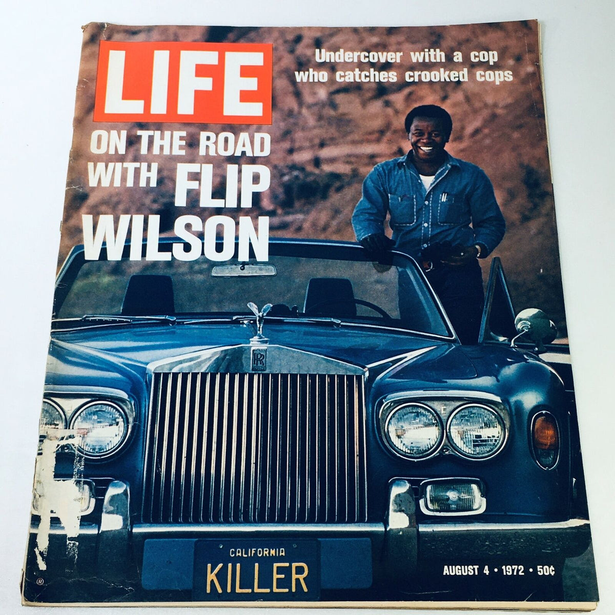 Cover of VTG Life Magazine August 4, 1972, featuring the title 'On The Road With Undercover Cop Flip Wilson', showcasing a man next to a blue Rolls Royce.