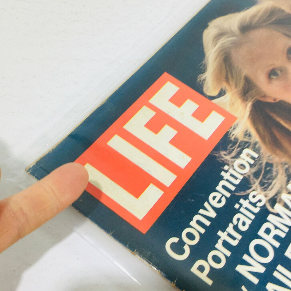 Close-up view of the VTG Life Magazine's cover from July 28, 1972, displaying the prominent 'LIFE' logo and details about Convention Portraits by Norman Mailer.
