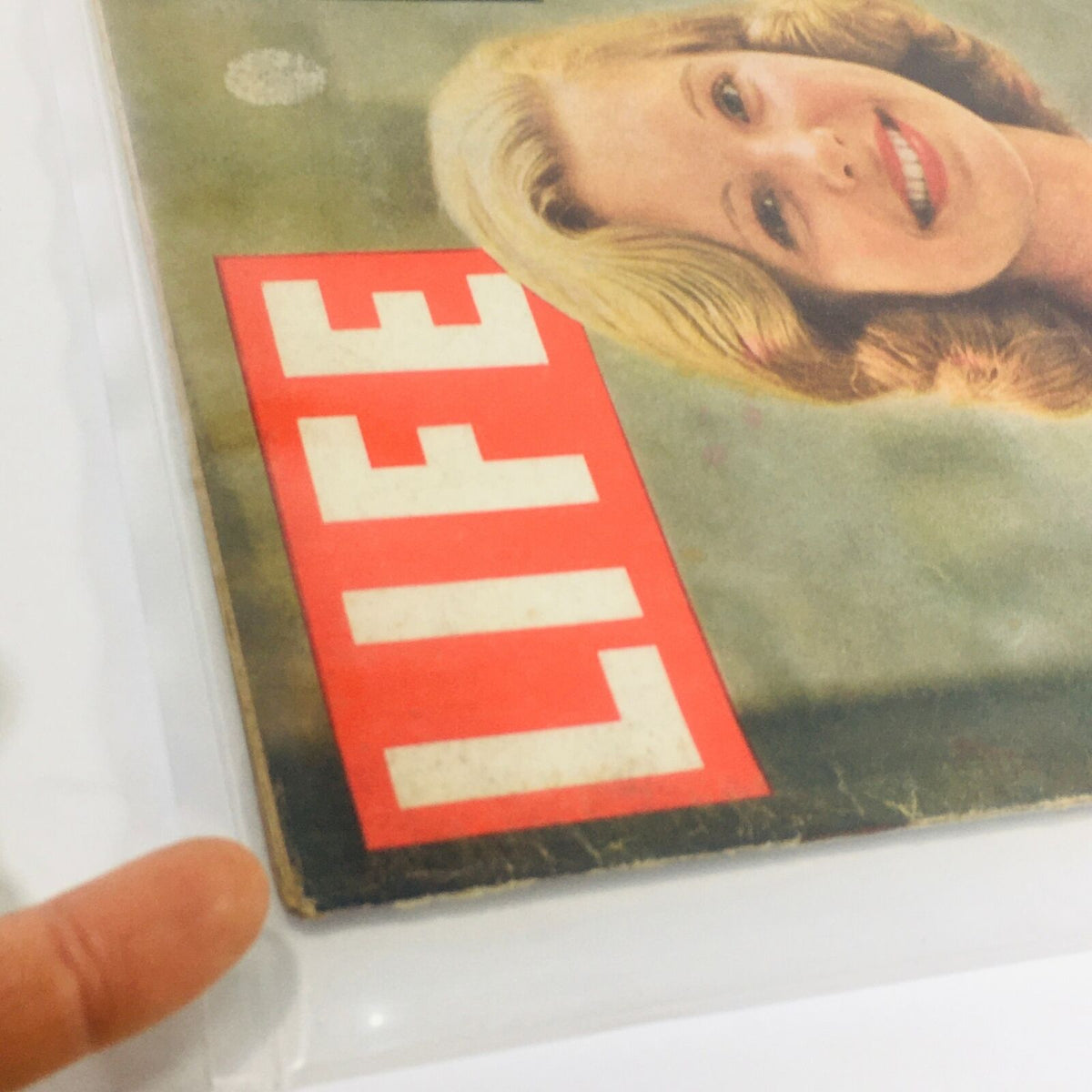 Detail of the VTG Life Magazine Cover from July 9, 1956, highlighting the magazine title 'LIFE' and signs of age on the edges.
